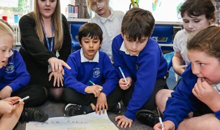 Students around a drawing