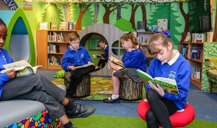 Children in library reading